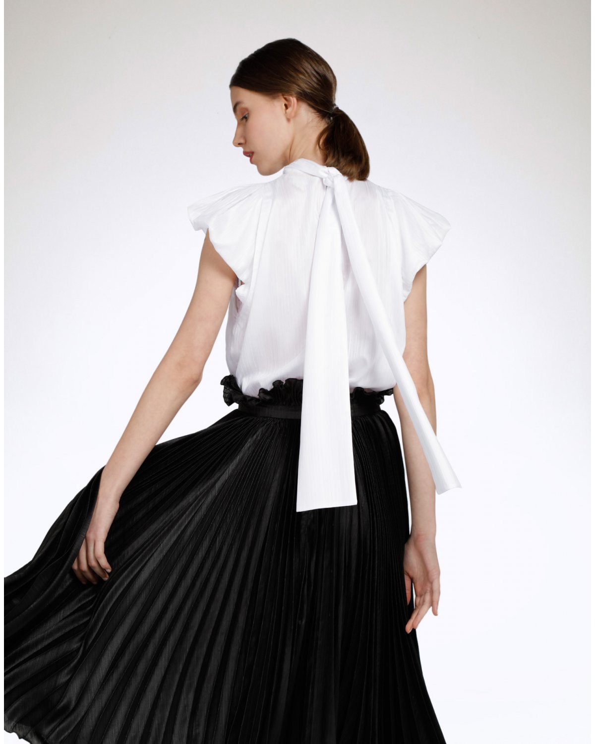 White blouse with puffball sleeves | | Genny