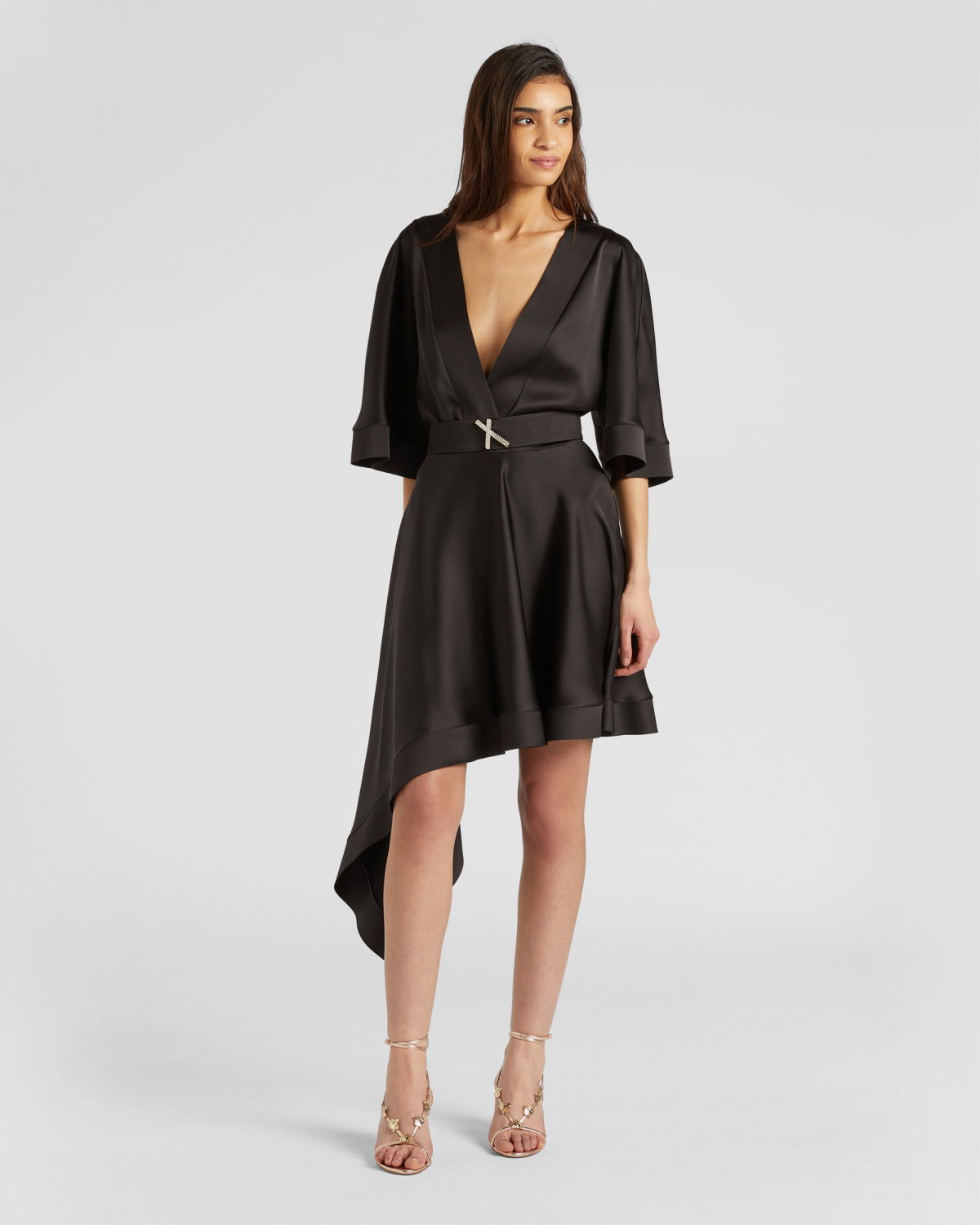 Dress with asymmetrical skirt | | Genny