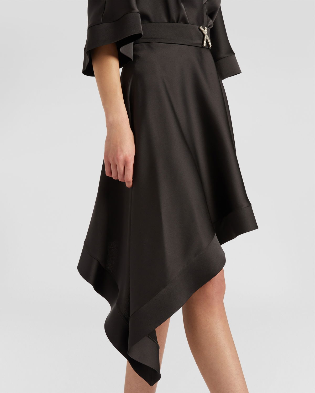 Dress with asymmetrical skirt | | Genny