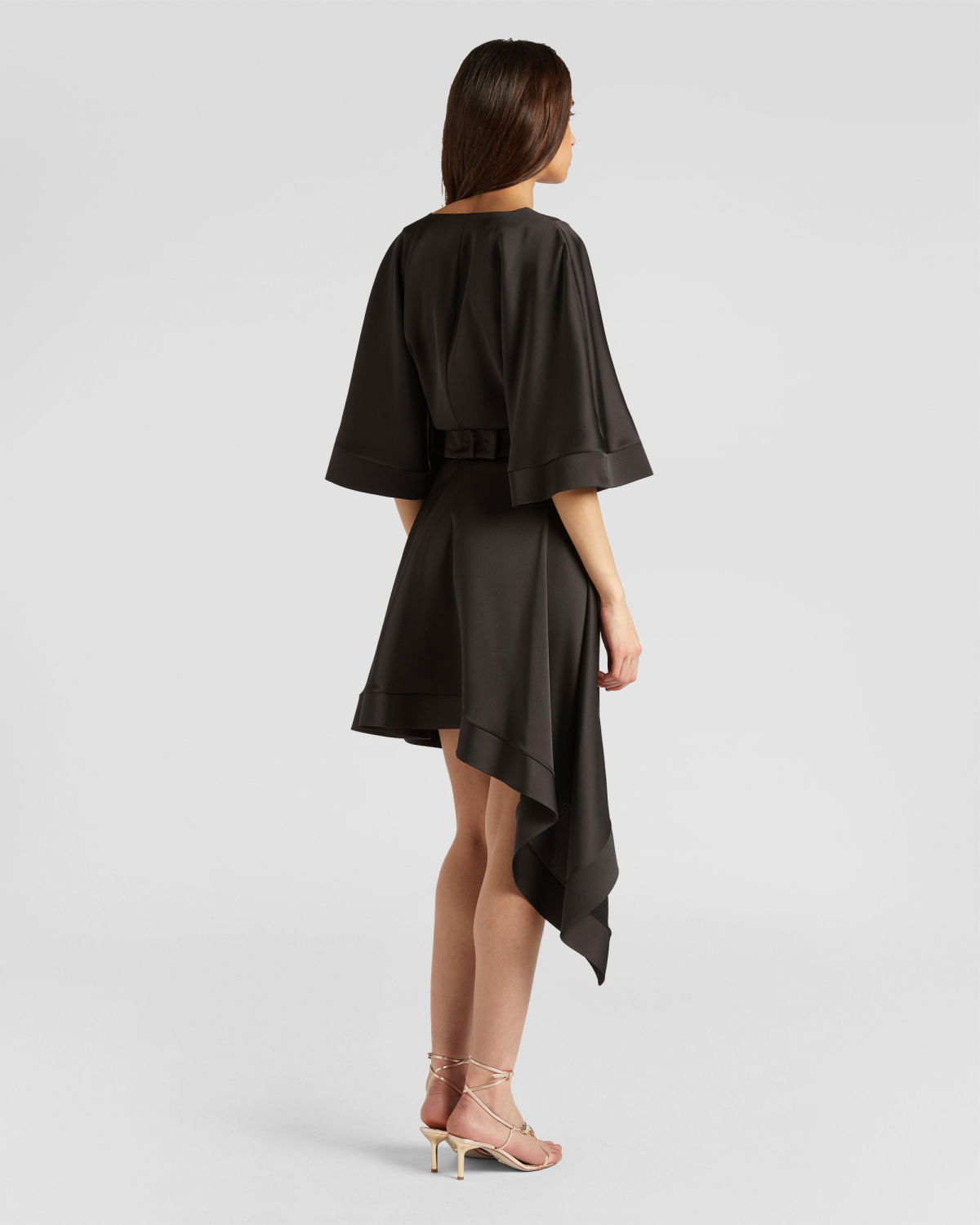 Dress with asymmetrical skirt | | Genny