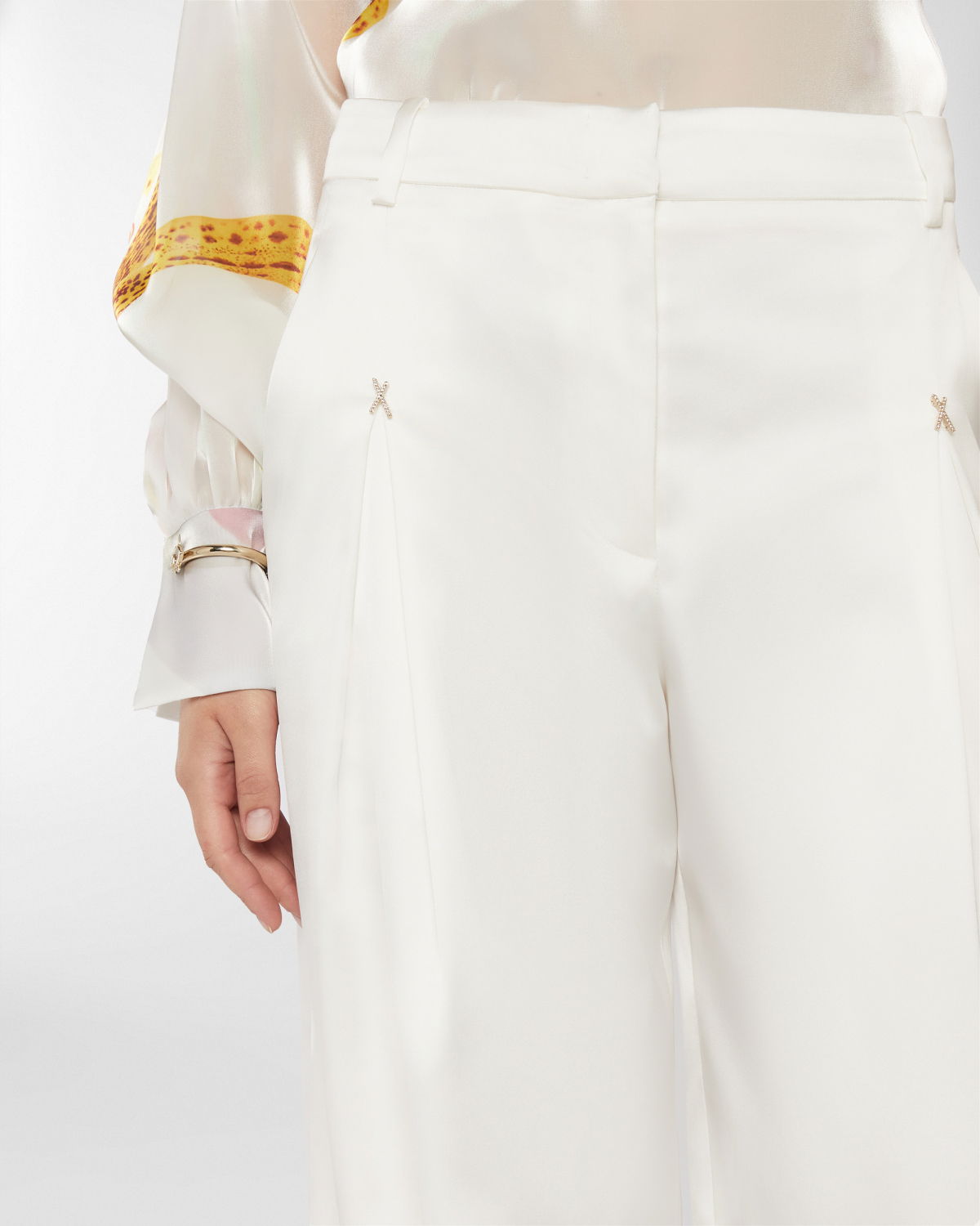 Wide satin pants with X | Resort 2025 Collection | Genny