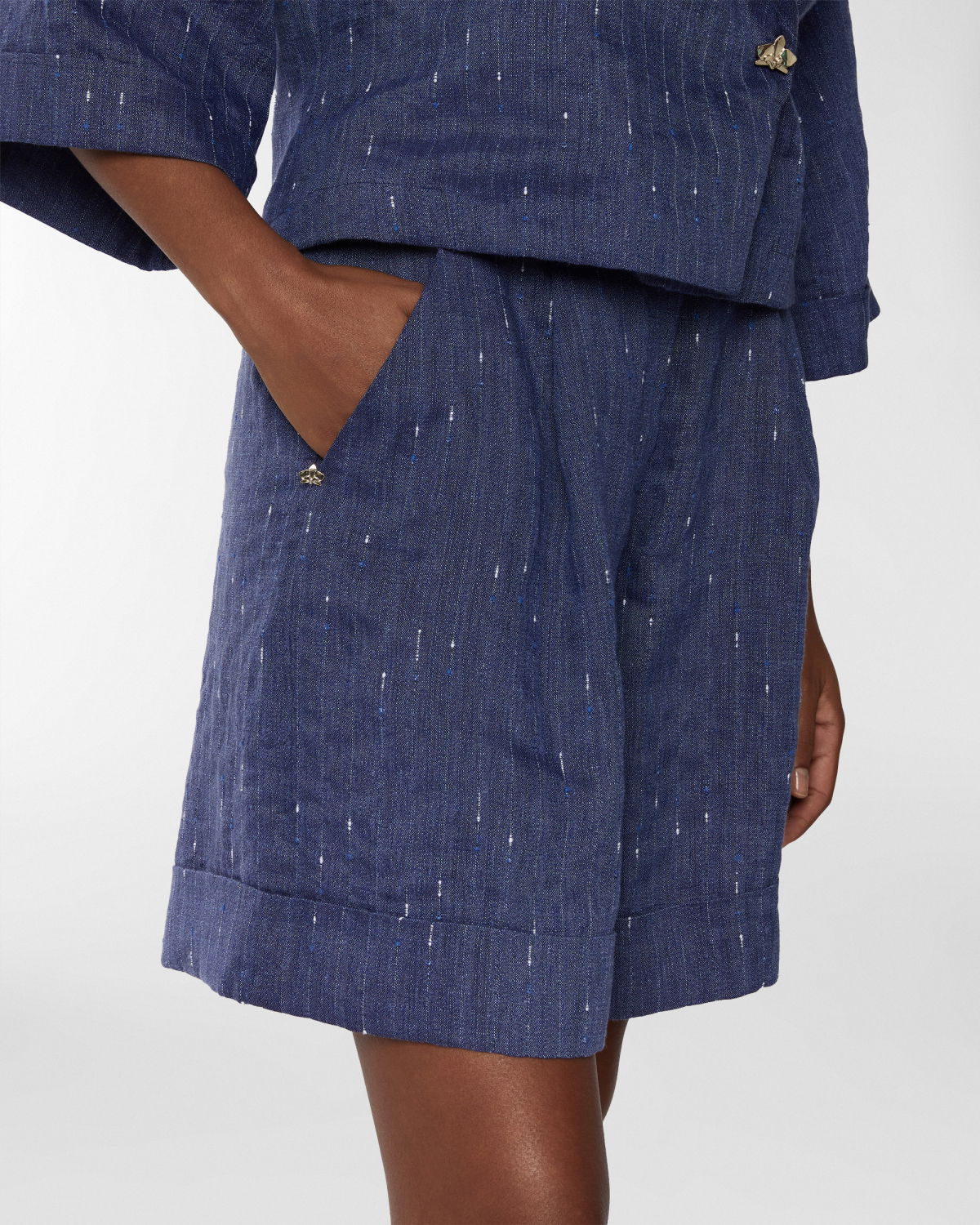 Pinstriped linen-blend shorts | Resort 2025 Collection | Genny